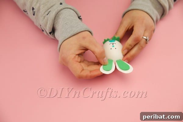 Hoppy Easter Egg Bunny Craft 21 Attaching assembled bunny ears to the top of the Easter egg