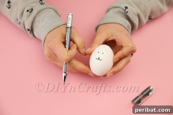 Hoppy Easter Egg Bunny Craft 6 Drawing the mouth for the Easter egg bunny