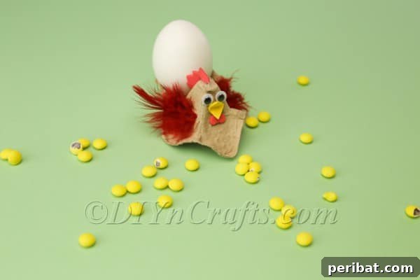 Craft Adorable Easter Hens from Egg Cartons 14 A finished egg carton hen with an egg placed in its back, ready for display.
