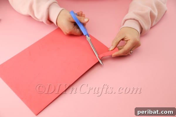 Craft Adorable Easter Hens from Egg Cartons 7 Cutting the red foam sheet to create the hen's comb.