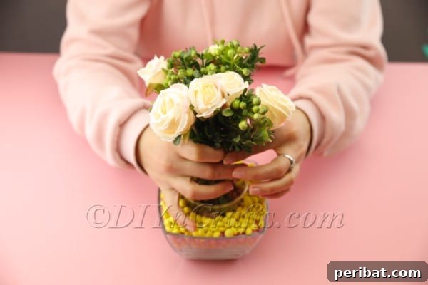 Arranging flowers in the candy vase