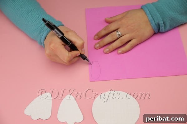 Drawing inner ear shapes on pink foam