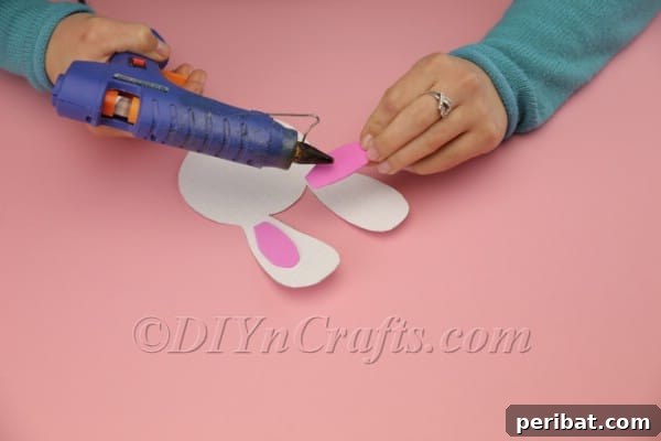 Gluing pink inner ear to main bunny ear