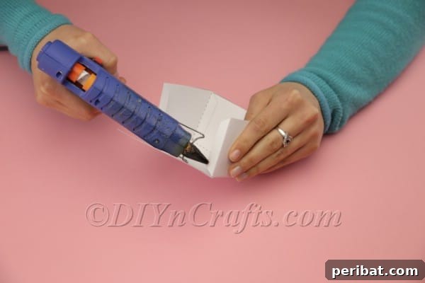 DIY Sweet Easter Bunny Treat Pouch Free Printable 21 Applying glue to box tabs