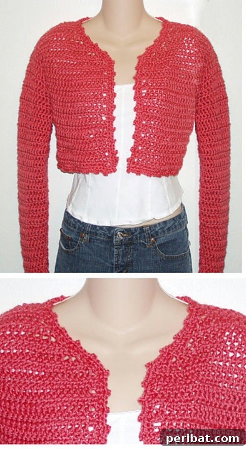 Coral Cropped Crochet Cardigan with long sleeves and a delicate pattern