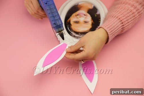 Step 8: Attach bunny ears to photo frame