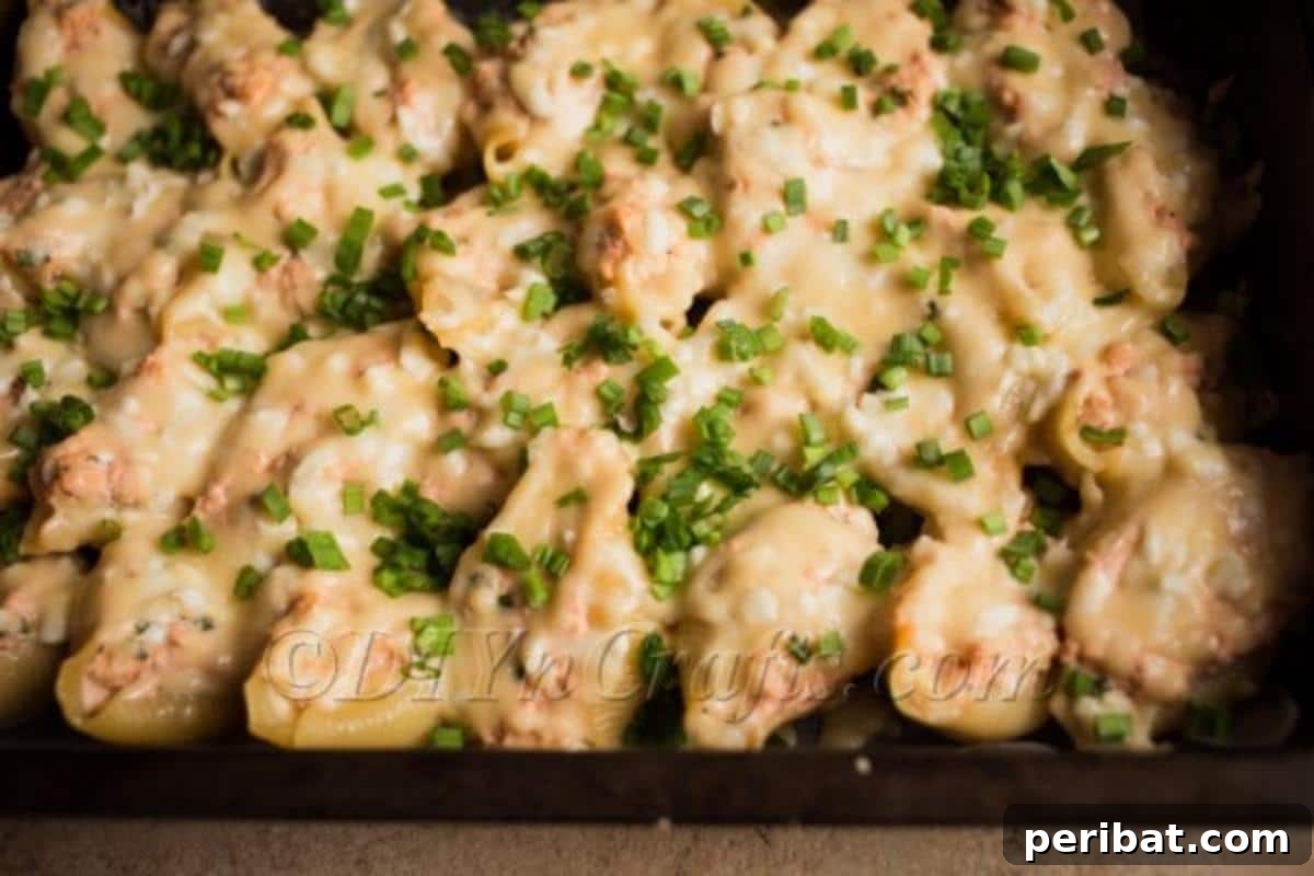 A dish of freshly cooked pasta shells, lightly steamed and ready for stuffing.