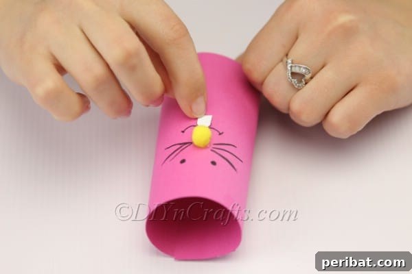 DIY Cute Paper Easter Bunny Candy Holder 11 Drawing whiskers and mouth on the paper bunny