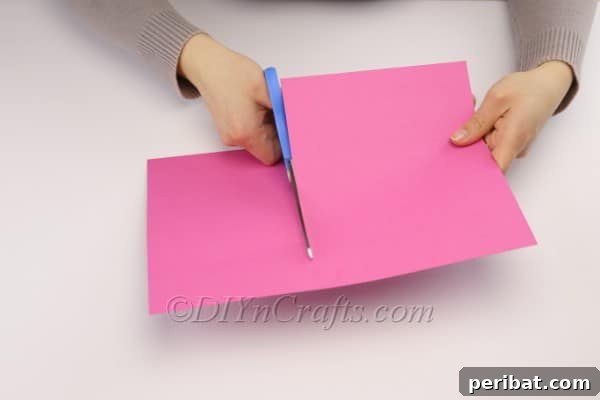 DIY Cute Paper Easter Bunny Candy Holder 5 Rolling construction paper into a tube