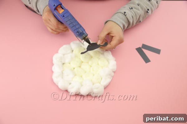 Fluffy Paper Plate Easter Sheep Craft 11 Attaching legs and head to the paper plate sheep