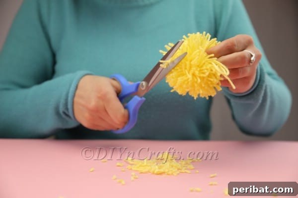 Completed fluffy yellow pom-pom