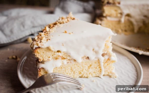 Deliciously Moist Coconut Cake with Tangy Cream Cheese Frosting
