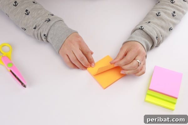 Transform Sticky Notes into a Vibrant Easter Wreath 6 Folding the sticky notes - Scalloped edge step