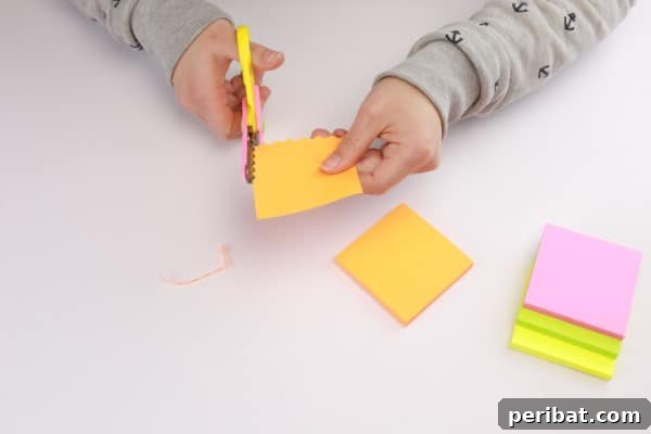 Transform Sticky Notes into a Vibrant Easter Wreath 7 Folding the sticky notes - Close-up of scalloped edge