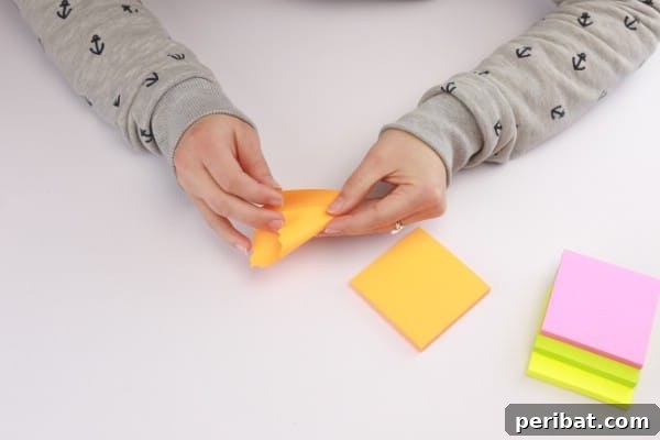 Transform Sticky Notes into a Vibrant Easter Wreath 8 Folding the sticky notes - Demonstrating folding technique