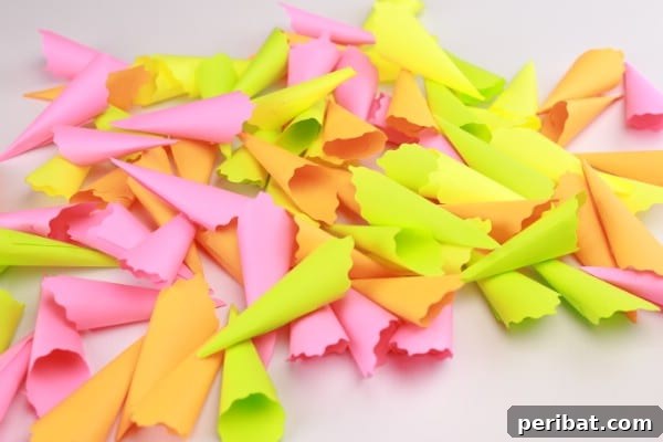 Transform Sticky Notes into a Vibrant Easter Wreath 10 Folded sticky notes ready to be glued - Pile of finished cones