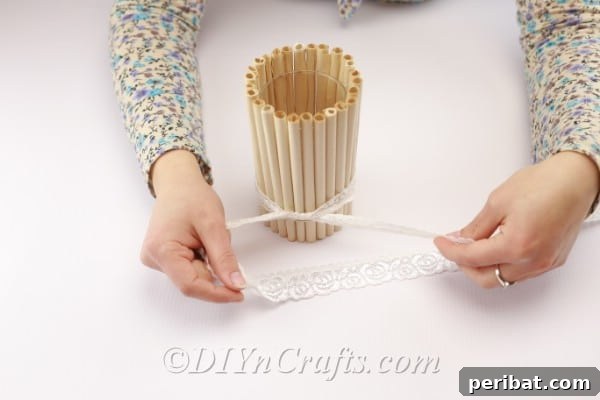 Rustic Easter Centerpiece: An Old Book's New Chapter 12 Fixing the attached book page rolls with a decorative ribbon.