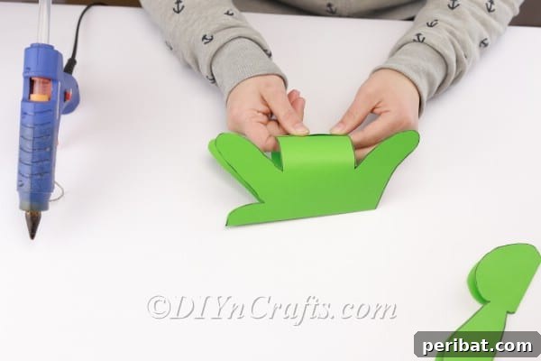 Making the body three dimensional by attaching the bottom part.