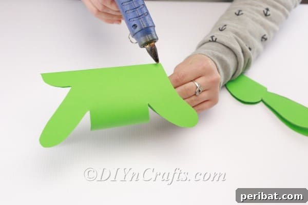 Craft a Charming Paper Easter Bunny 15 Gluing the bunny's head to the body.