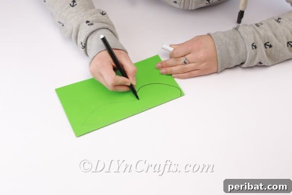 Craft a Charming Paper Easter Bunny 7 Drawing the shape of the head.