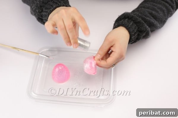 Transform Your Plastic Eggs: Easter Decor DIY 7 Applying glitter.