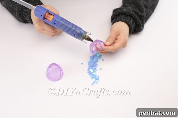 Transform Your Plastic Eggs: Easter Decor DIY 8 Manually placing sequins to decorate the plastic egg.