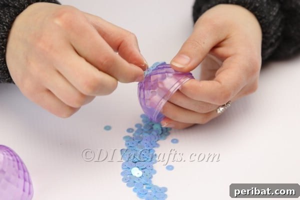 Transform Your Plastic Eggs: Easter Decor DIY 9 Manually placing sequins to decorate the plastic egg.
