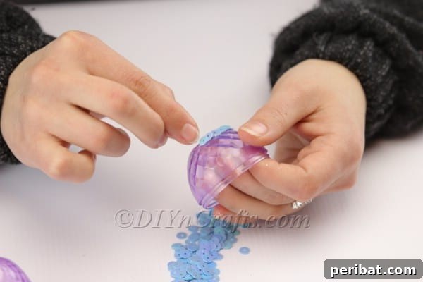 Transform Your Plastic Eggs: Easter Decor DIY 10 Manually placing sequins to decorate the plastic egg.