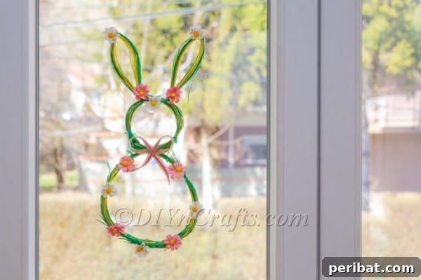 Craft an Adorable Bunny Easter Wreath 16 Finished bunny wreath proudly displayed on windows, bringing spring cheer.