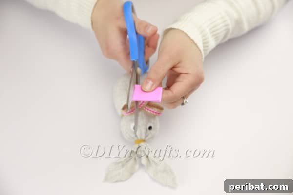 Attaching a pink foam sheet as which'll form the bunny's belly.