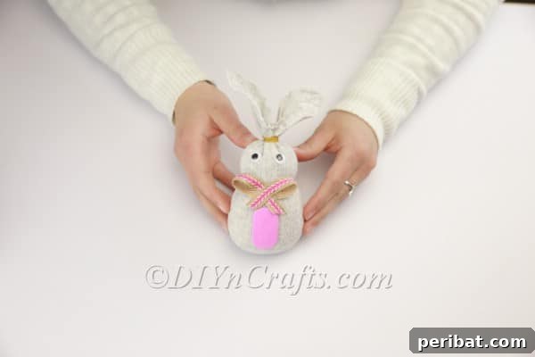 Attaching a pink foam sheet as which'll form the bunny's belly.