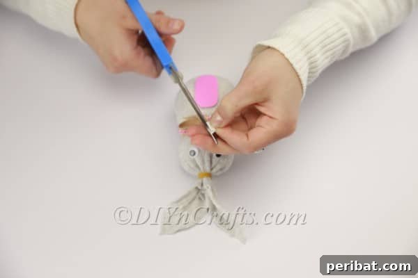 Gluing the bunny's teeth.