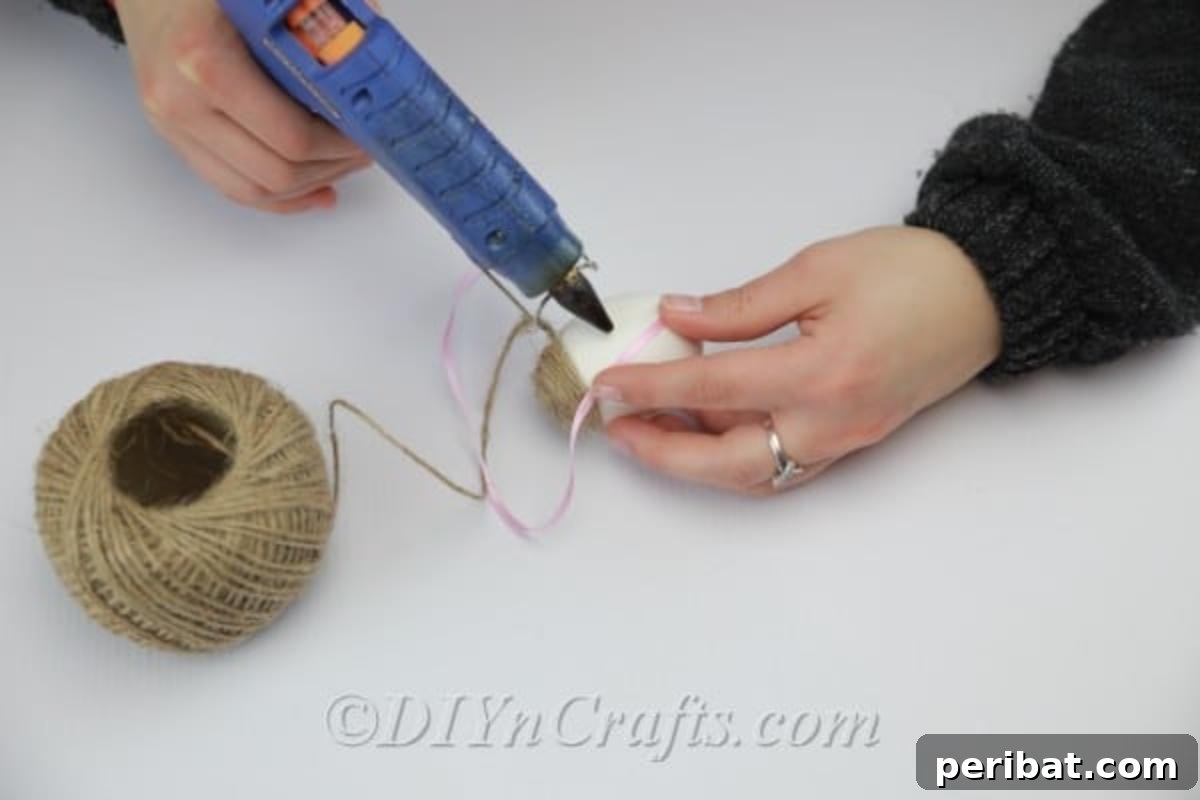 Farmhouse Style Twine Easter Eggs 5 Fixing the twine on the glued parts of the egg.