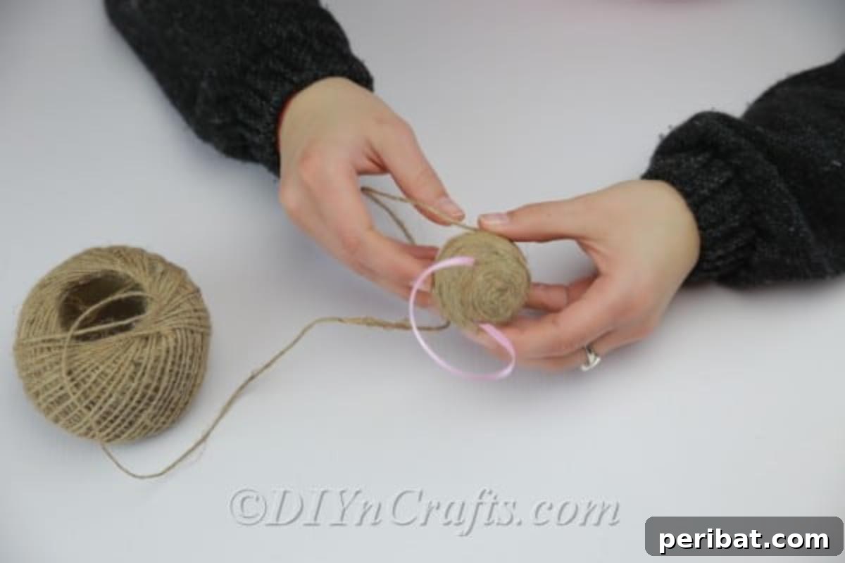 Farmhouse Style Twine Easter Eggs 7 Continue to attach twine using hot glue.