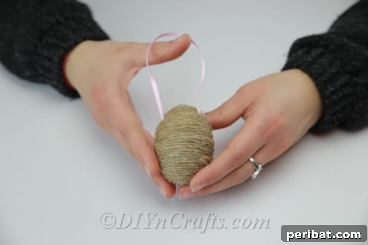Farmhouse Style Twine Easter Eggs 9 The egg is fully covered with twine. Time to decorate it further.