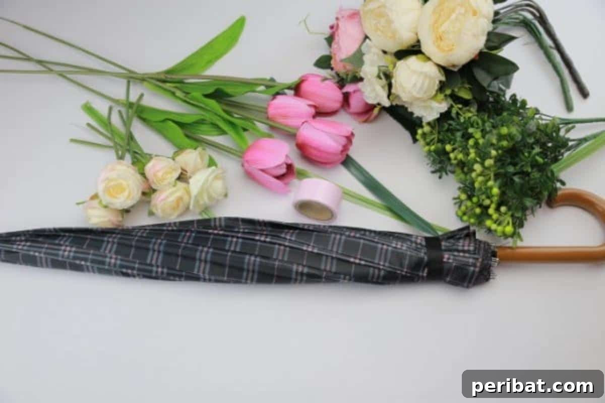 Materials and tools used for creating a DIY umbrella bouquet door decor.