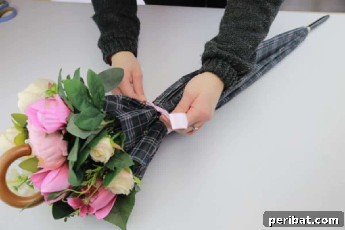 Tie the umbrella securely with a piece of ribbon to hold the flowers in place.