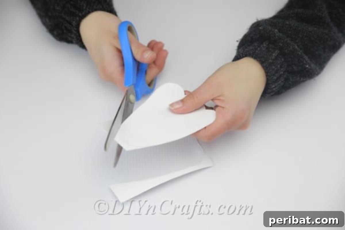 Craft an Adorable Easter Bunny from a Repurposed Party Ball 15 Cut the bunny's feet out of white cardboard.