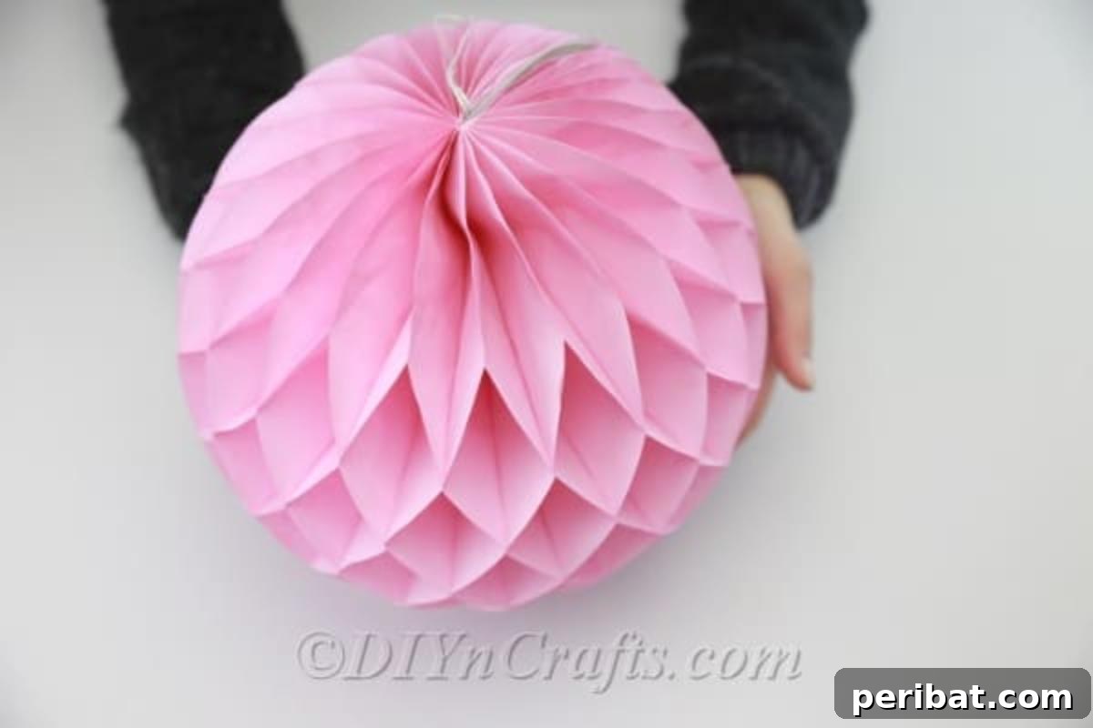 Craft an Adorable Easter Bunny from a Repurposed Party Ball 4 Expand the party ball to get it ready for the project.