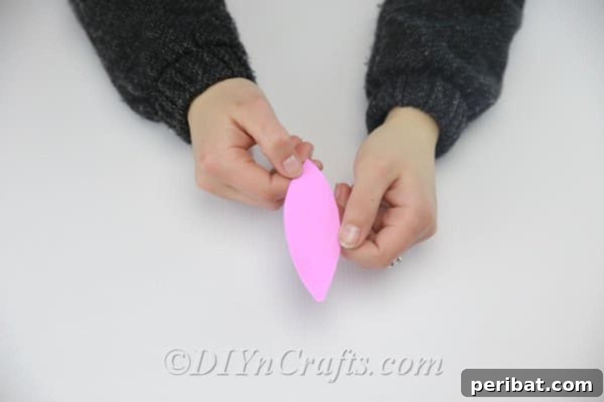 Craft an Adorable Easter Bunny from a Repurposed Party Ball 9 Cut out smaller ear shapes from pink foam sheet, you're gonna use them for the bunny's inner ear.