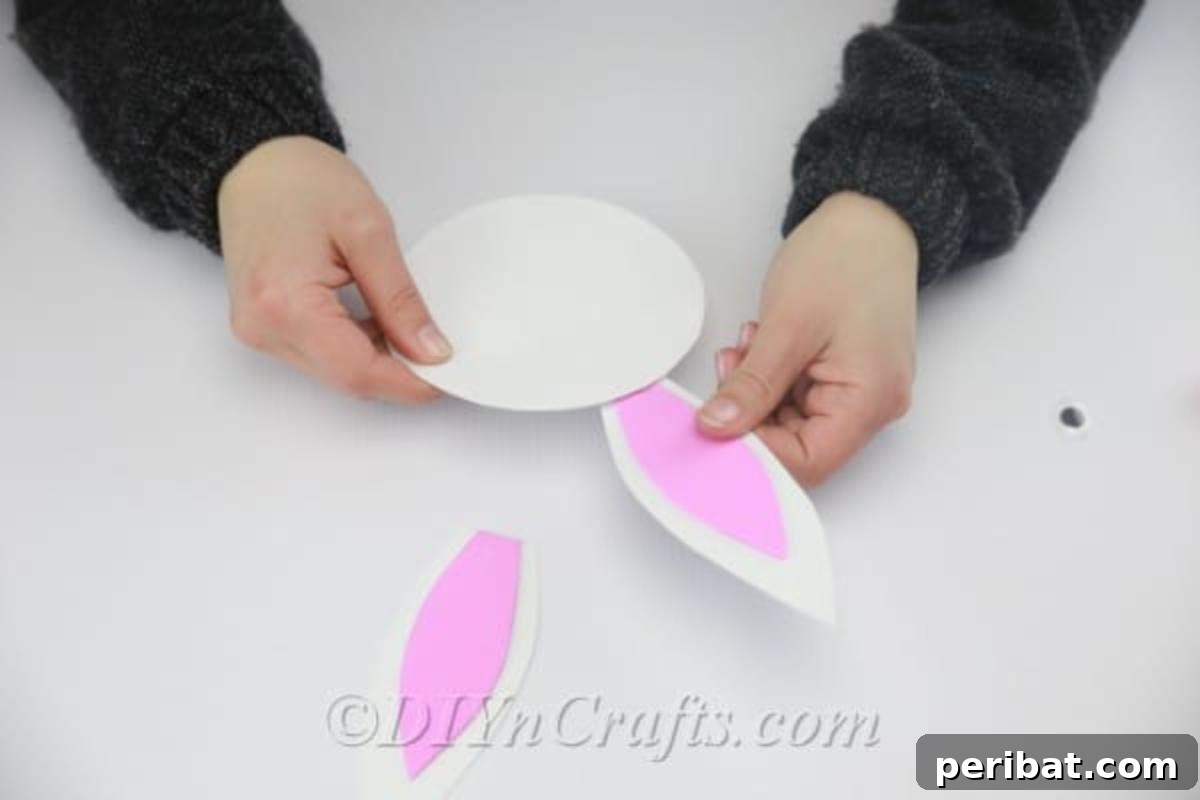 Craft an Adorable Easter Bunny from a Repurposed Party Ball 10 Glue the inner ear to the outer ears.