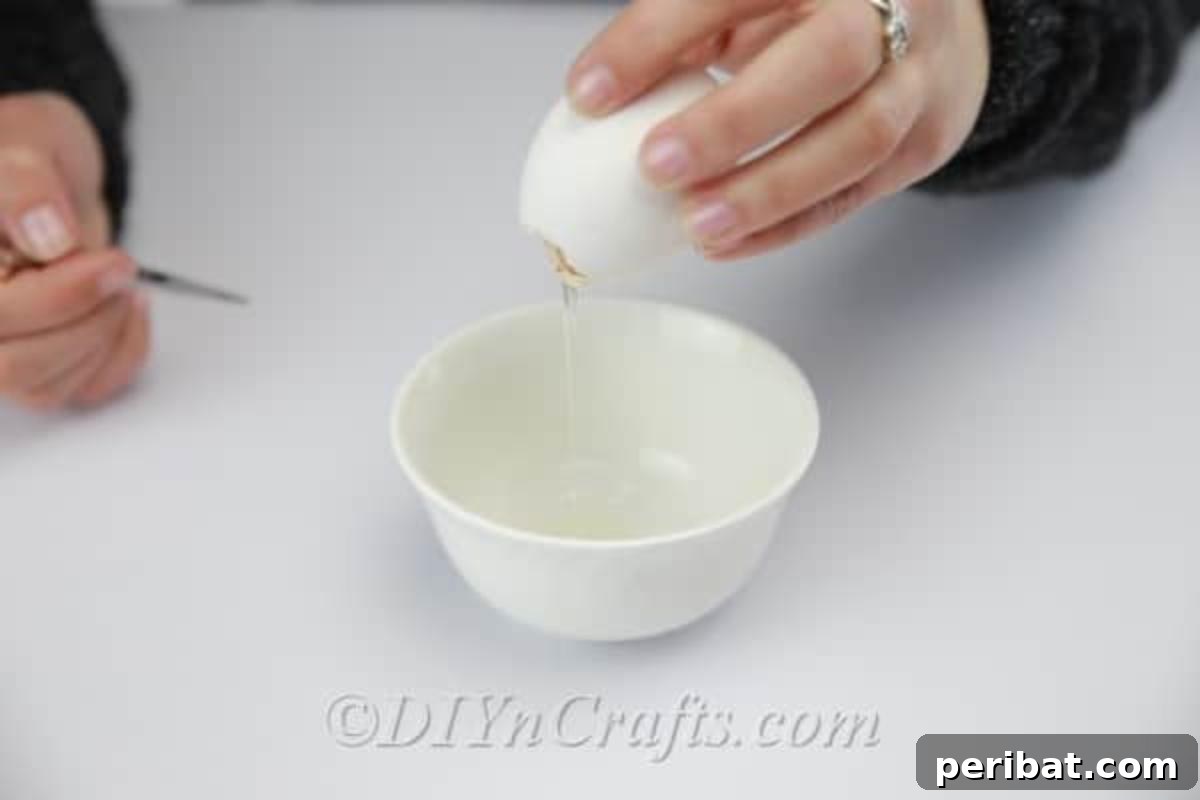 Hatch a DIY Easter Egg Planter 5 Emptying the egg yolk to get a nice clean eggshell.