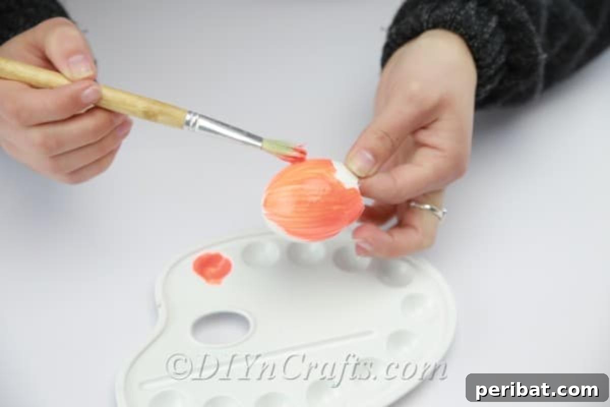 Hatch a DIY Easter Egg Planter 9 Painting the empty eggshell.