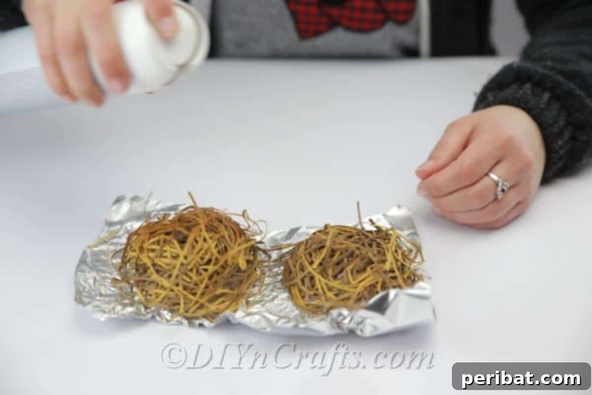 Craft a Realistic Bird Nest for Easter Treats 11 Applying hairspray to the paper strips on the bird's nest mold