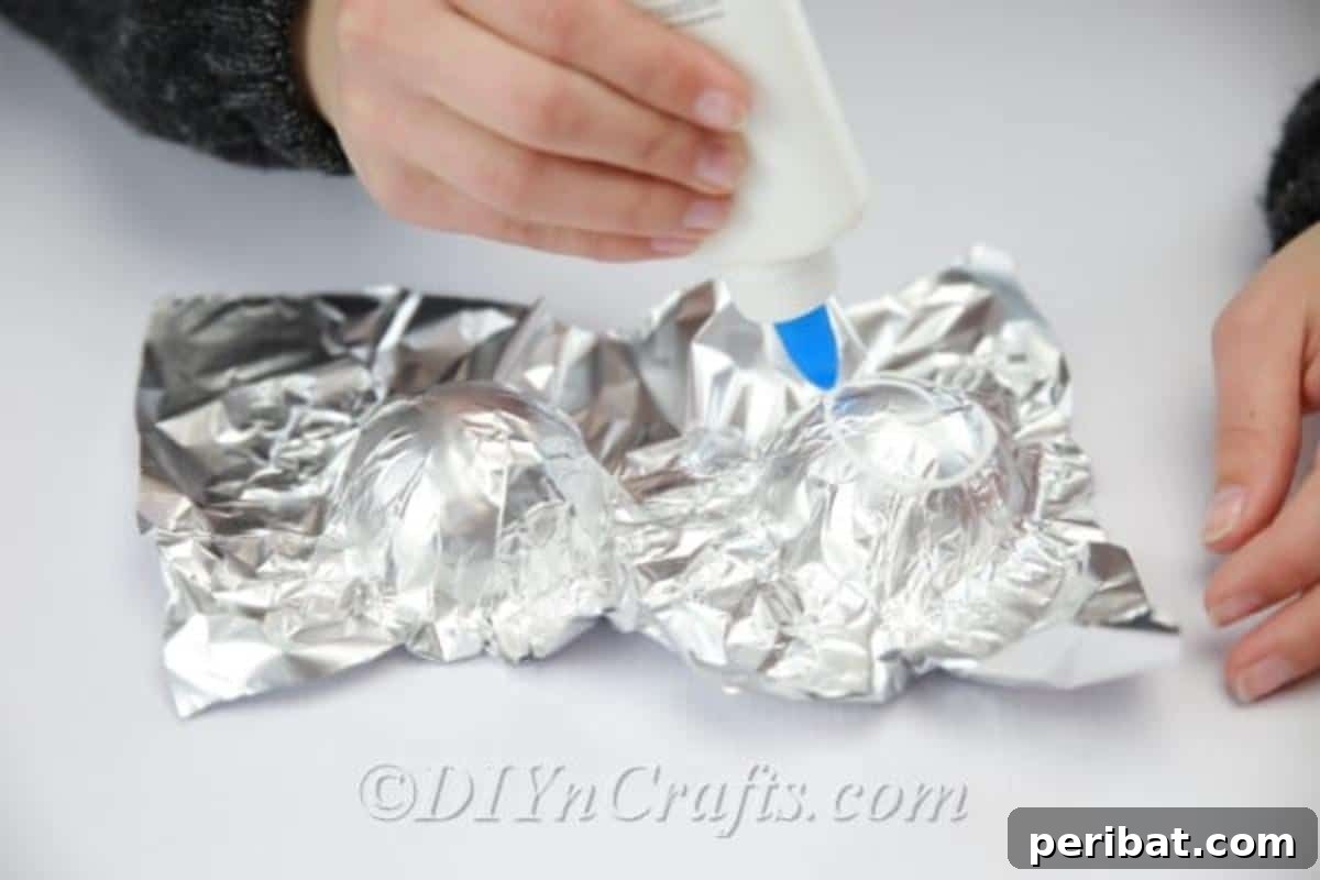 Craft a Realistic Bird Nest for Easter Treats 6 Preparing the aluminum foil mold by shaping it into the desired nest form