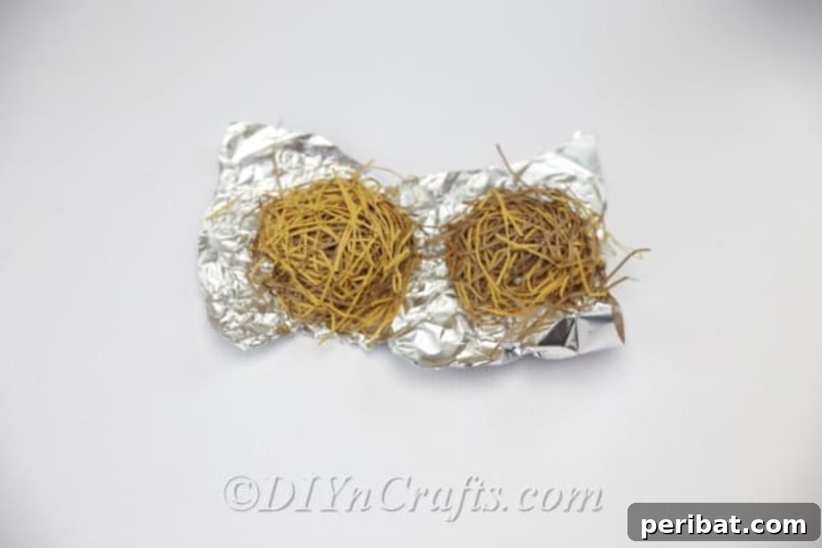 Craft a Realistic Bird Nest for Easter Treats 10 Final stages of placing paper strips inside the aluminum foil mold for the nest