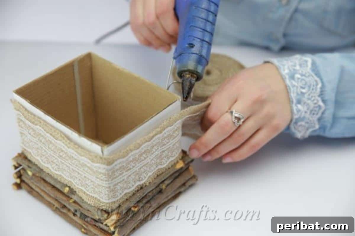 Create Beautiful Rustic Floral Displays for Easter 11 Wrapping decorative lace ribbon around the upper section of the box, above the sticks.