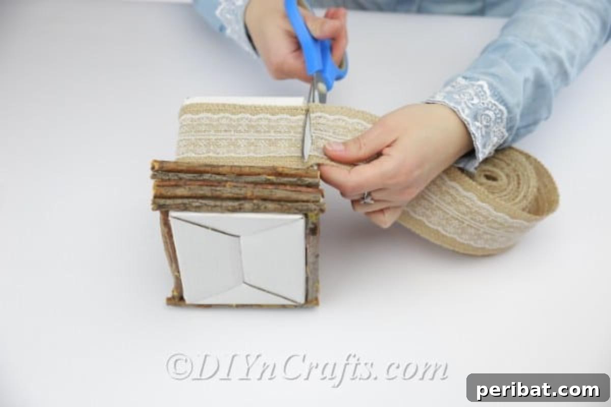 Create Beautiful Rustic Floral Displays for Easter 12 The process of applying the decor ribbon, showing careful placement and tension.