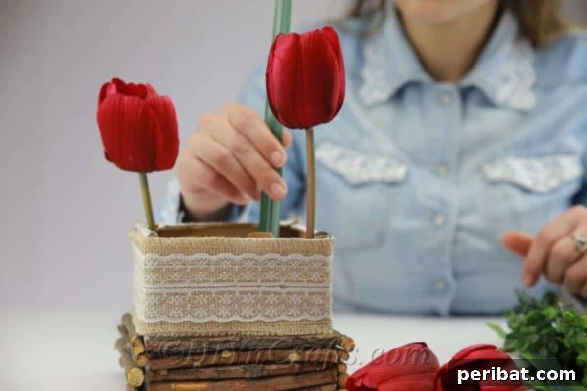 Create Beautiful Rustic Floral Displays for Easter 14 Filling the decorated box with faux tulips and green sprigs to create the floral arrangement.
