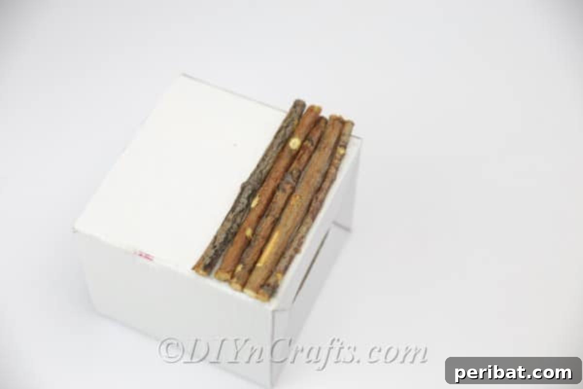 Create Beautiful Rustic Floral Displays for Easter 8 Adding subsequent rows of sticks to build up the rustic base on one side.